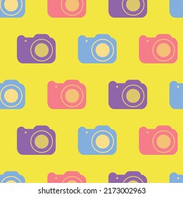 Photo camera seamless pattern. Icon photo camera in retro color palette. Retro cameras in yellow background. Design for print on fabric, wrapping paper, packaging. Vector illustration in flat design