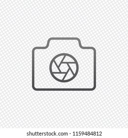 Photo camera with shutter, linear symbol with thin outline, simple icon. On grid background