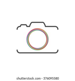 Photo camera silhouette with colorful circle