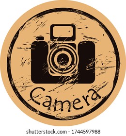 Photo camera silhouette icon vector round shabby emblem design, old retro style. Old camera logo mail stamp on craft paper. Film camera shape vintage grunge sign. Icon for web design. Flat design.