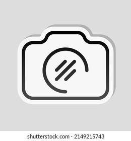 Photo camera, simple digital icon. Linear sticker, white border and simple shadow on gray background