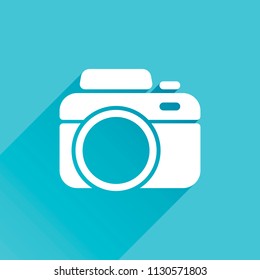 Photo camera, simple icon. Gray icon with long shadow in bottom left corner on blue background