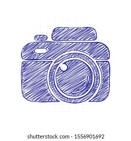 Photo camera, simple icon. Hand drawn sketched picture with scribble fill. Blue ink. Doodle on white background