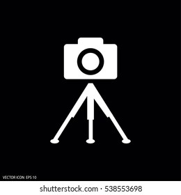 photo camera. tripod.