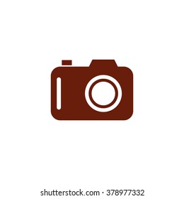 Photo camera. Vector icon brown
