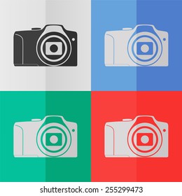 Photo camera vector icon. Effect of folded paper. Colored (red, blue, green) illustrations. Flat design