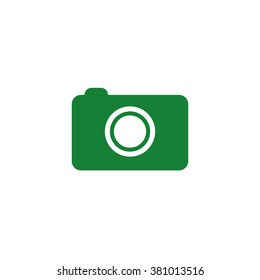 Photo camera. Vector icon green
