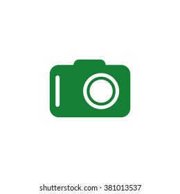 Photo camera. Vector icon green
