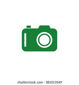 Photo camera. Vector icon green
