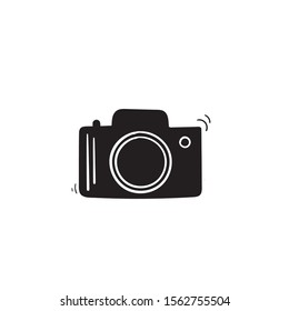 Photo camera vector icon with hand drawn doodle style isolated on white
