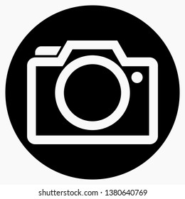 Photo camera vector icon on dark background.