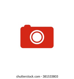 Photo camera. Vector icon red
