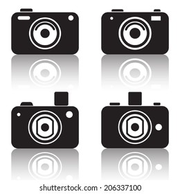 Photo camera vector icons. Black silhouettes with reflection.