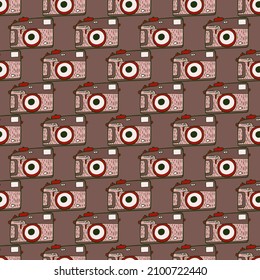 Photo camera vintage seamless pattern. Retro photo cameras design. Repeated texture in doodle style for fabric, wrapping paper, wallpaper, tissue. Vector illustration.