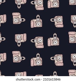 Photo camera vintage seamless pattern. Retro photo cameras design. Repeated texture in doodle style for fabric, wrapping paper, wallpaper, tissue. Vector illustration.