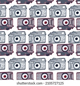 Photo camera vintage seamless pattern. Retro photo cameras design. Repeated texture in doodle style for fabric, wrapping paper, wallpaper, tissue. Vector illustration.