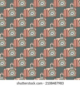 Photo camera vintage seamless pattern. Retro photo cameras design. Repeated texture in doodle style for fabric, wrapping paper, wallpaper, tissue. Vector illustration.