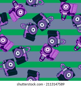 Photo camera vintage seamless pattern. Retro photo cameras design. Repeated texture in doodle style for fabric, wrapping paper, wallpaper, tissue. Vector illustration.