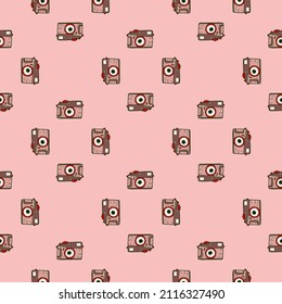 Photo camera vintage seamless pattern. Retro photo cameras design. Repeated texture in doodle style for fabric, wrapping paper, wallpaper, tissue. Vector illustration.