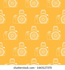 Photo cameras seamless pattern white on a gold background.
