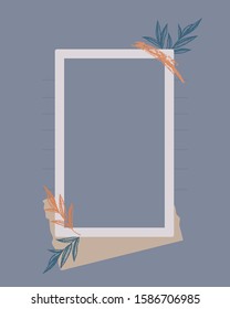 Photo frame on blue background decorated with leave