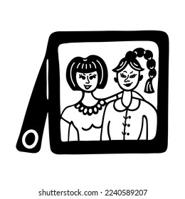 Photo frame with a portraits of girls. Simple vector icon. Hand drawn doodle isolated on white. A picture with a couple of girlfriends or lesbians. Two women hugging, smiling. Clipart for prints, web