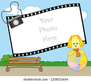 Photo frame with a puppy playing with ball in the park