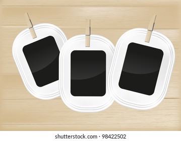 Photo frame set on light wood background