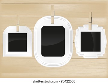 Photo frame set on light wood background