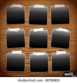 Photo frame stick on wooden background