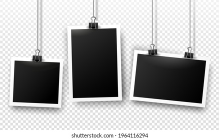 Photo frames hanging on binder clips with shadows. Vector templates set for editing. Realistic illustration of empty photo isolated on transparent gray background.