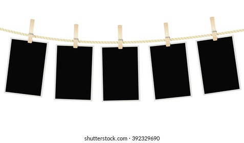 Photo frames hanging on clothesline with clothespins on white