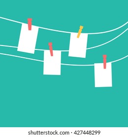 Photo frames hanging on a rope with clothespins  vector
