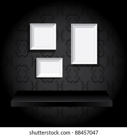 Photo frames and on the wall above the shelf
