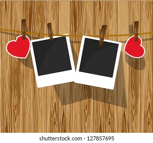 Photo frames on wood background. Valentine day card.