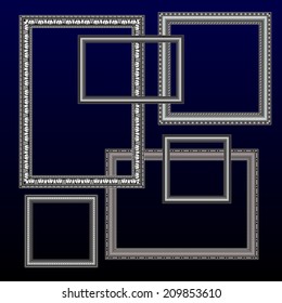 photo frames and pictures silver on a dark blue background