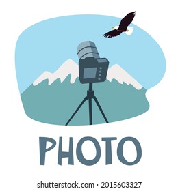 Photo graphic icon. A camera on a tripod among the mountain landscape