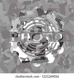 Photo on grey camouflaged pattern