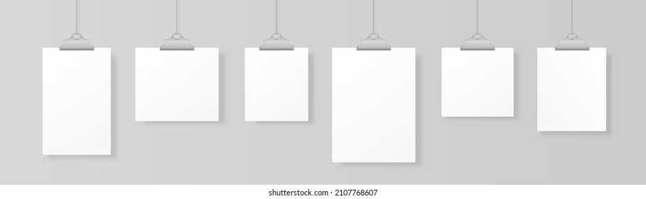 Photo picture hanging, frame paper gallery portfolio. A4 paper sheet hangs on a rope with clips. Empty mockup frames for your drawings, quotes or lettering. Realistic white poster hanging. Vector.