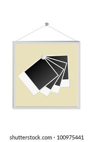 photo set of frames attached to a metal pin in a wooden frame isolated on white background