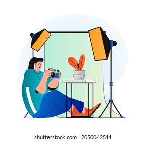 Photo studio concept in modern flat design. Woman photographer with photo camera works in professional salon with equipment, makes photoshoots, art and commercial photography. Vector illustration
