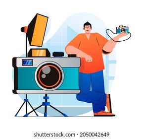 Photo studio concept in modern flat design. Man standing by huge photo camera works in professional with equipment. Photographer makes photoshoots, art and commercial photography. Vector illustration