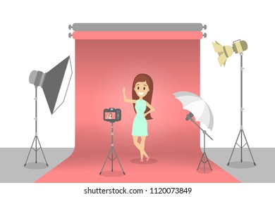 At photo studio with equipment and lightning.