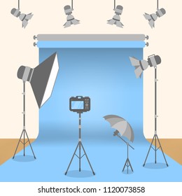At photo studio with equipment and lightning.