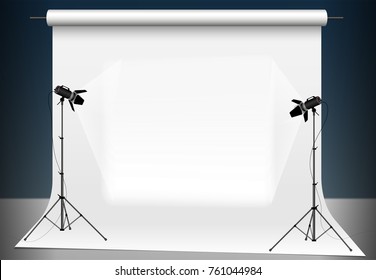 Photo studio with a light and blank background. Lighting with two studio flashlights. Supports for photographic equipment. Copy space.