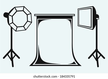 Photo studio with lighting equipment. Isolated on blue background