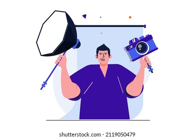 Photo studio modern flat concept for web banner design. Happy photographer holding camera and spotlight. Man posing with professional photo equipment. Vector illustration with isolated people scene