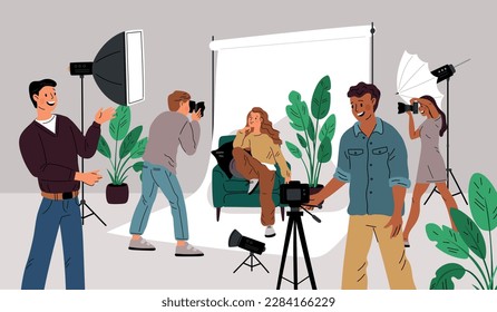 Photo studio. Young beautiful girl poses for beginners and professional photographers. Photographic backstage shooting and spotlights. Cameraman taking snapshots. Garish