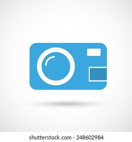 Photocamera with shadow on the gray background.Eps 10 vector file.