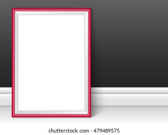 Photoframe template. Red picture framing mockup. Frame near the black wall on the floor with realistic shadows. Vector template for presentation your photo art or other crafts.
